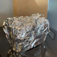 The owner asked how far we had to travel and made sure to wrap our pints to make sure they stayed cold!  at Royal Cafe in Fairport