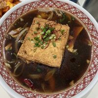 Signature black hot noodle soup   at Plantude 플랜튜드 in Seoul