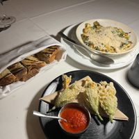 Zucchini blossoms, and Mushroom Scallop with a side of bread   at Crossroads Kitchen in Las Vegas