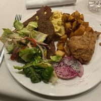 potatos, “eggs “, “bacon” “sausage” salad, fried chickn  at Crossroads Kitchen in Las Vegas