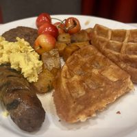 Sunday brunch breakfast potatoes, waffles, sausage, scrambled eggs and cherries   at Crossroads Kitchen in Las Vegas