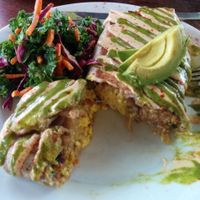 Super Vegano Burrito. Delicious pepper kale tofu, sausage, hash browns, mozzarella, avocado, cashew cream. Salad - kale, red cabbage, carrots in a citrusy dressing. So good & filling.  at A N D Cafe in Portland