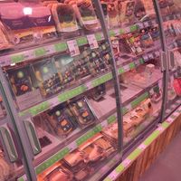 Refrigerated counter with labeled vegan products at EkoPlaza - Elandsgracht in Amsterdam