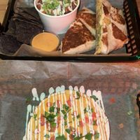 crunchwrap with jackfruit, bodega potatoes, & side of queso. mexipie tostadas.   at JDs VegMex in Miami