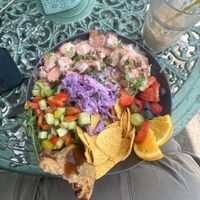 Think this was some sort of rice bowl w/ spicy sausage, samosa, tortilla crisps, salad, fruit etc  at The Chakra Lounge in Bakewell