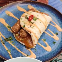 Naan wrap with vegan sausages and sweet and sour fruit chutney at The Chakra Lounge in Bakewell