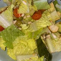 Tuscan Salad (Vegan Option) - cos lettuce, charred zucchini, tomato, green olives, braised cannellini beans, croutons, confit garlic dressing.   at Pippi's at the Point in Speers Point