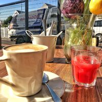 Oat milk coffee and raspberry juice   at We Cafe - Maybe closed in Cape Town