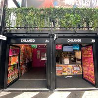 Left container has 4 screens for ordering, right container is where you collect the food at Chilango in Croydon