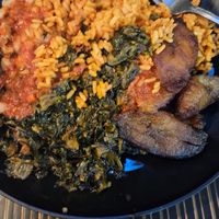 Vegan jollof rice, vegan spinach stew with beans, and plantains  at The Village PVD in Providence