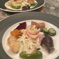 Steamed Vegetable plate consisting of tiny slices of each veg. Aubergine was nice but king oyster mushroom was completely raw  at Mominoki House in Tokyo