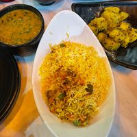 Daal palak, vegetable biryani, and Bombay aloo  at Mother India in Mellieha