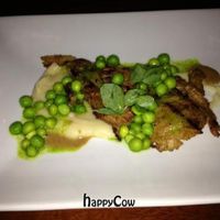 grilled seitan, creamy turnips, beech mushrooms, English peas, and truffle mustard at Vedge in Philadelphia