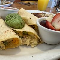 Vegan egg/meat/veggie/cheese taco with potatoes and fruit!  at Stacks in Redwood City