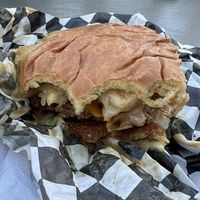 Paradise burger with big slice of grilled pineapple   at Tabay's Mindful Kitchen in Kahului