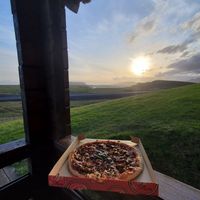 10/10 recommend dinner with a view! at Black Crust Pizzeria in Vik