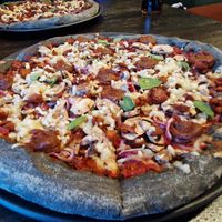 Homemade date pesto, red onion, mushroom, fresh basil, vegan mozzarella & pulled BBQ soy mince #Veganuary at Black Crust Pizzeria in Vik