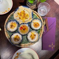 Steamed Rice Cakes
Banh Bèo - Bánh Dúc 85
Coconut-rice batter steamed & garnished with peanuts & fried onions, served w/our House sauce.
 at Shamballa Vegetarian Bistro HoiAn in Hoi An