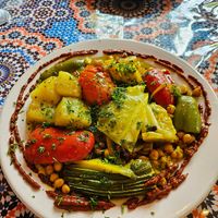 Veggie dish on couscous- INCREDIBLE layered flavor and filling! at Kasbah Moroccan Cafe in Portland