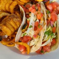Grilled veggie soft tacos with curly fries at Wrightsville Beach Brewery in Wilmington