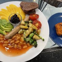 Vegan breakfast plate, 179 baht. I’d have never thought of having mango and baked beans on the same plate, but this was really good!  at Heaven Burger in Chiang Rai