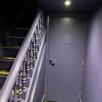 Labyrinthine lavender subterranean toilet tunnel at Tendril in London