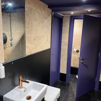 Purple women’s bathroom at Tendril in London