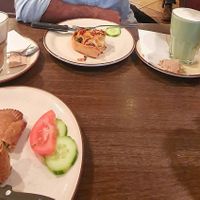 Pizza type and feta pice, matcha latte and macciato latte at Holzbackerei Bio Andreas in Basel