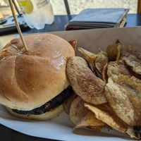 Veggie burger and chips. Burger had aioli, tomato, red onion, and arugula. at Beer Tree Brew in Port Crane