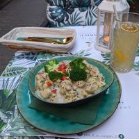 Almost chicken and broccoli in a creamy sauce with cous cous and homemade iced green tea. at Yes It Is Vegan II - Liszt Ferenc Tér in Budapest