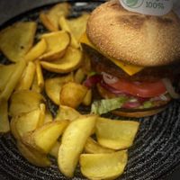 Hamburguesa Vegana de cheddar Vegano y patatas at Es Cactus in Menorca