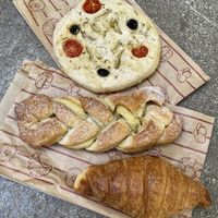 Focaccia, pastry with vanilla custard filling and croissant  at La Revuelta in Granada