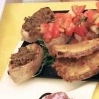 Antipasti miati con cous cous, bruschette, melanzane impanate fritte e ceci speziati at La Trinacria Ristorante Trattoria Pizzeria in Enna