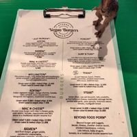 Rex and the menu at Athens Vegan Burgers in Athens