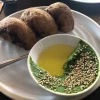 Stuffed bread starter with kale butter and sesame seeds.   at Folke in Vancouver