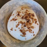 Apple pie filling on a cake with whipped cream at Folke in Vancouver