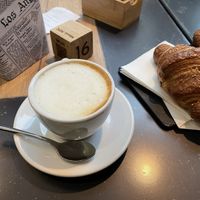 Soy cappuccino and vegan brioche filled with orange jam  at T-Bakery in Bergamo
