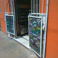 Entrance with menu boards at Loving Hut Lince in Lima