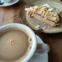 Coffee with oat milk & strawberry almond cake. at Wild&Wood in Wiesbaden