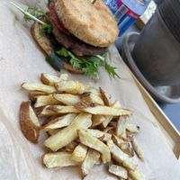 Vegan burger and bun with chips   at streat in Pecs
