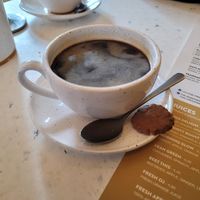 Vegan cookie with coffee at Oats Day Long in Leuven