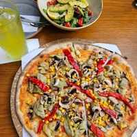 Vegan pizza and mozzarella salad without the mozzarella at Pizza Locale in Baku
