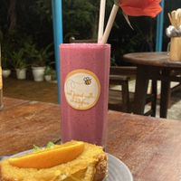 Orange cake with a custom smoothie (banana, dragonfruit and peanut butter) they will make custom ones if you ask nicely😇  at Chickpea Eatery Thuan Chay in Hoi An