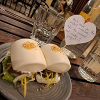 Delicious bao bun starter with a positive message at Chickpea Eatery Thuan Chay in Hoi An