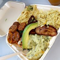 Stew chunk plate w/ plantain, rice, pasta, mashed potato & avocado   at Amore Arowako Vegan Club in St John