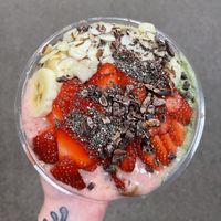 This is a Pacific Green Bowl with half Stupid Cupid base, almond butter, and cacao nibs! I also added vegan vanilla protein to my base! 🖤🍓  at Playa Bowls in Manchester