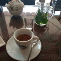 Caffè e acqua e menta offerta at Gran Caffè Friuli in Udine