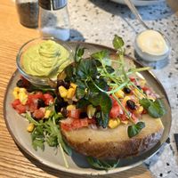 Baked potato with tomato, corn, beans and guacamole  at Maison S in Sint-truiden