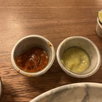 Chipotle sauce and jalapeño sauce  at La Santa Guadalupe - Centro Histórico in Cartagena