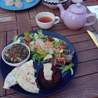 Home made pita bread with a beetroot burger, green lentils, a salad, and tea at Tibetan Convention Tea House in Florennes